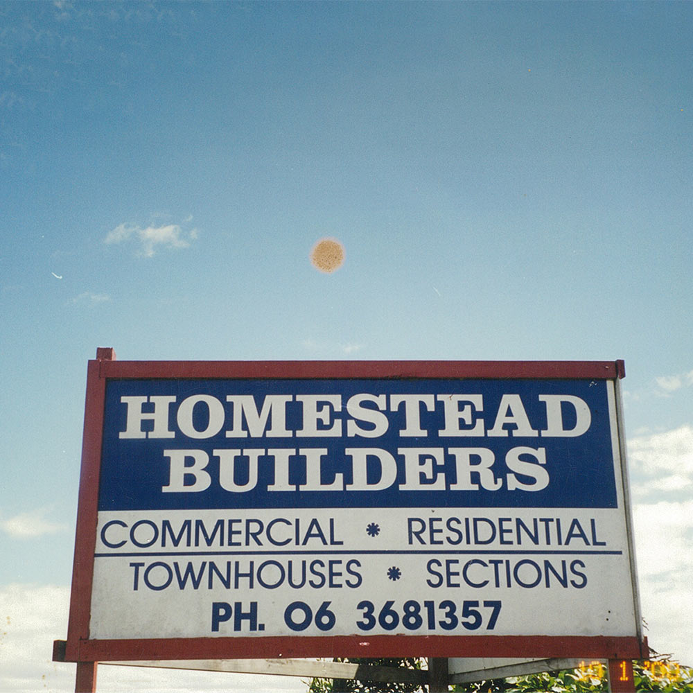 homestead builders old sign