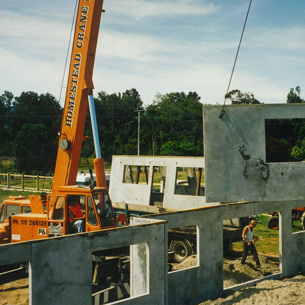 homestead construction old crane lifting panels onsite